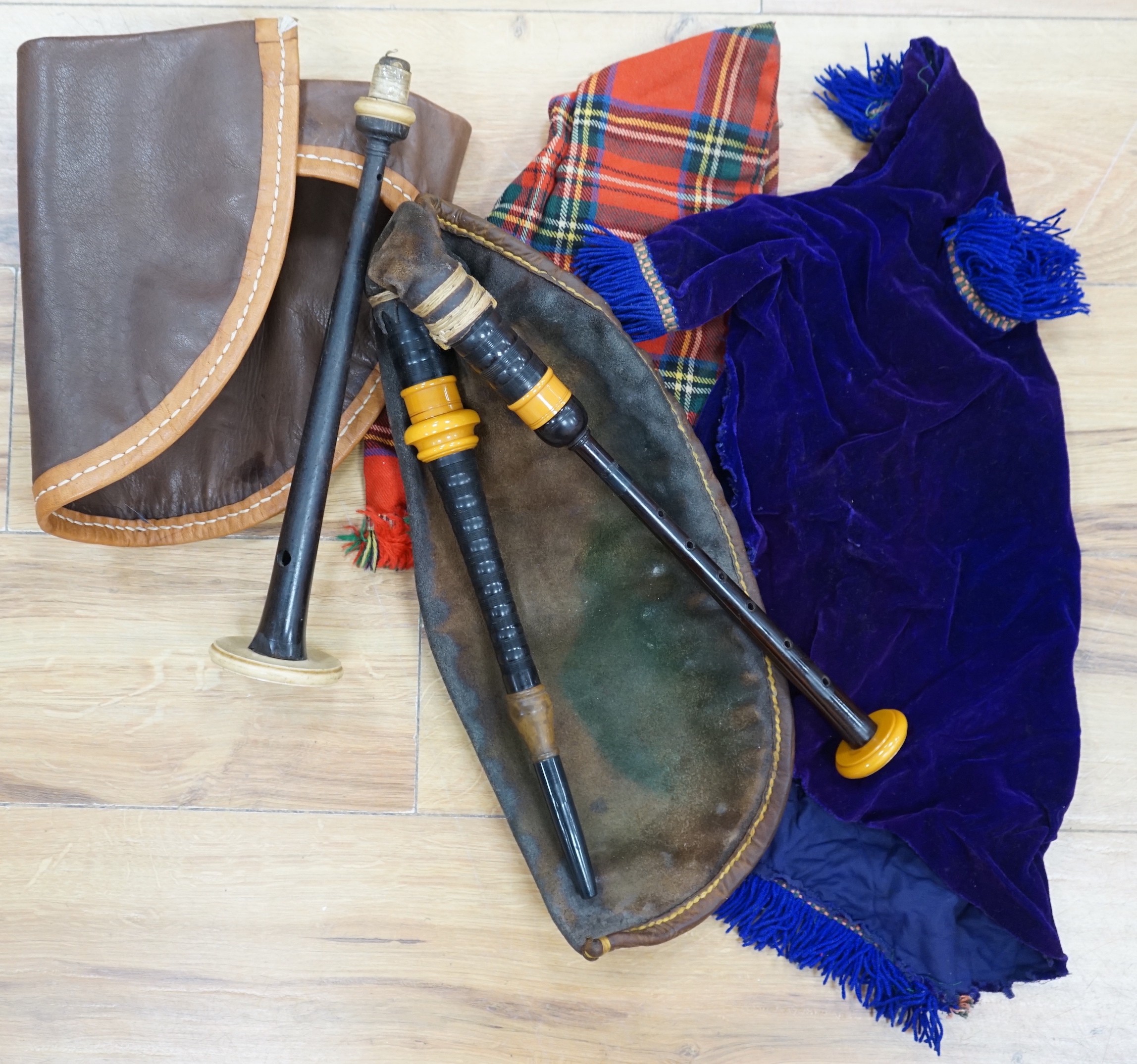 Two practice sets of bagpipes, one cased